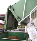 empty 660 litre bin into skip